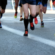 miguel-a-amutio-Y0woUmyxGrw-unsplash Legs of runners in brightly coloured shorts and trainers