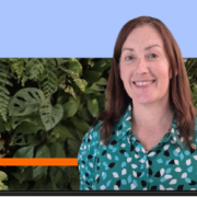 Smiling woman with green patterned shirt